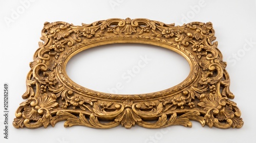 Ornate antique gold picture frame with intricate carvings and floral motifs.
