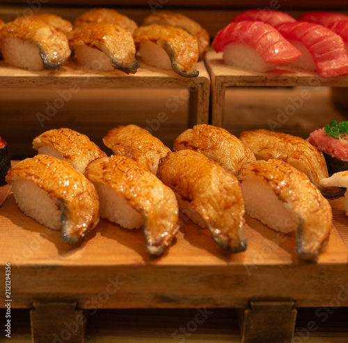 a selection of Aburi Sushi, featuring lightly torched toppings that create a caramelized texture