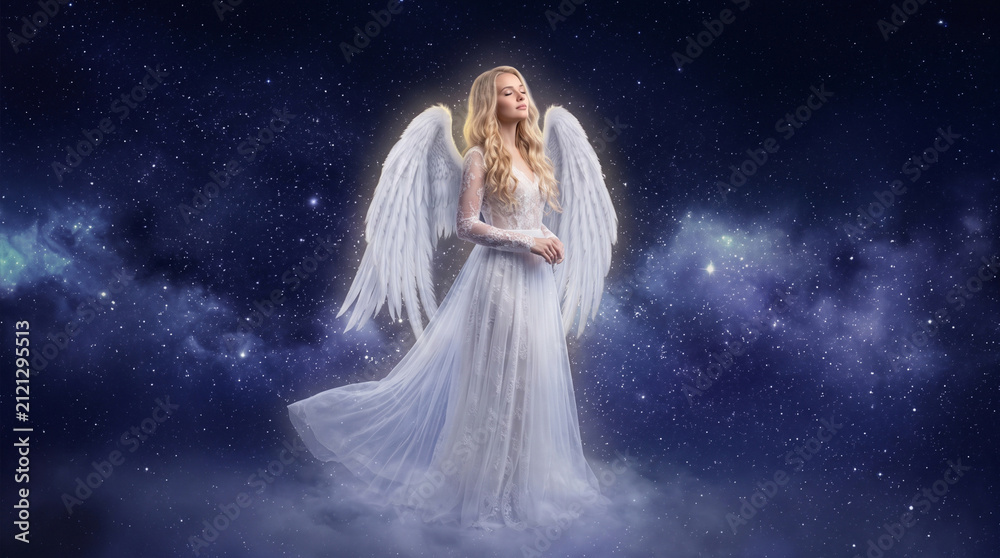 Fototapeta premium Beautiful divine angelic woman with blond hair and white feather wings standing in the starry night sky