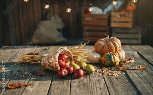 Rustic Autumn Harvest Still Life with Apples Pears Pumpkins Wheat and Cornucopia on Wooden Table