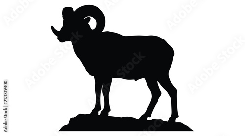 Bighorn sheep standing on rocky terrain black silhouette