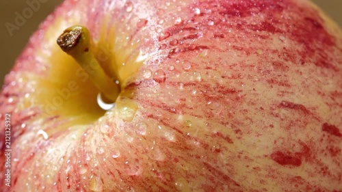 Fresh Red Apple with Water Droplets on Its Skin