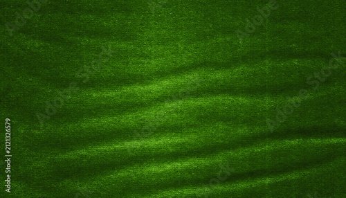 Shiny green texture with a soft surface, wavy folds and subtle highlights. Elegant abstract background ideal for design, decoration and graphic compositions.