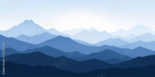 Majestic Mountain Landscape with Misty Fog at Sunrise Over Forest Valley and Snowy Peaks Under a Blue Morning Sky
