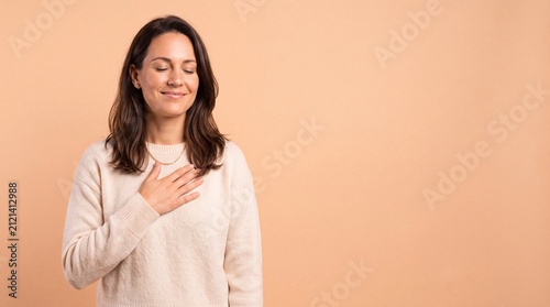 A woman with brown hair wearing a beige sweater standing with her eyes closed and hand on ad social media download thambnail poster web template event festival 2026 2027 2028