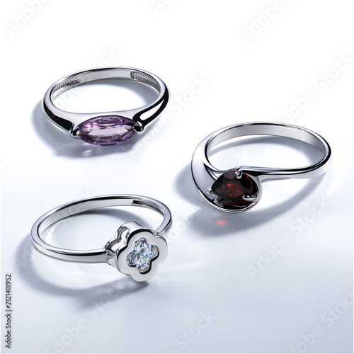 Fotografie Elegant Collection of Three Unique Rings Featuring Amethyst, Garnet, and Diamond