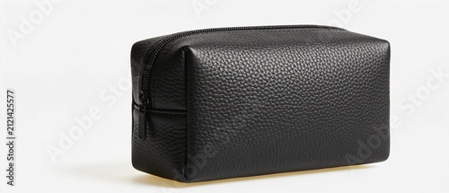 Minimalist black leather toiletry pouch with textured surface on white background