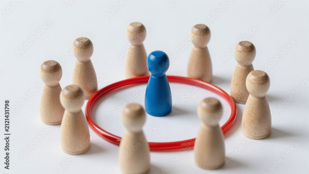Obraz premium Blue Wooden Peg Figure in Red Ring – Surrounded by Unpainted Figures for Personal Space, Setting Boundaries, Isolation from Society, Individuality, Healthy Personal Limits
