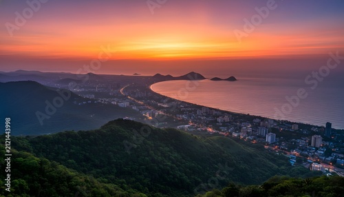 Sunset view of the coastal Visakhapatnam city skyline from a high vantage point vanta over the ocean bay for travel destination and urban growth concept