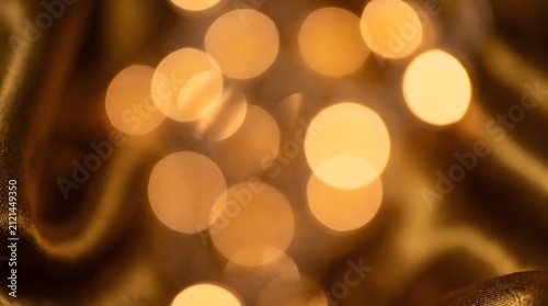 Bokeh lights create a warm and glowing atmosphere in this soft out of focus background.