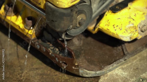 Water Dripping From a Vibrating Plate Compactor
