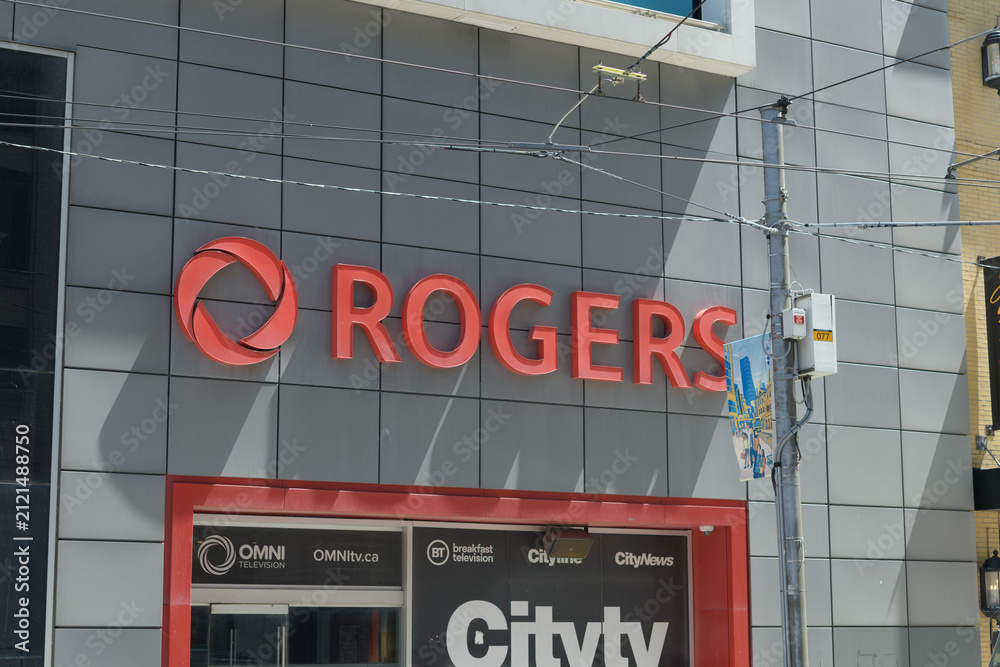 Fototapeta premium Rogers Communications logo on the outside of 33 Dundas St E, a former studio, near Sankofa Square, Toronto