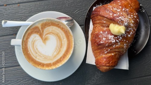 cup of cappuccino with croissant
