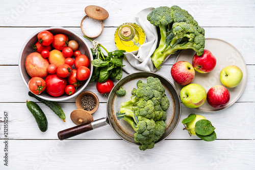 Фотография Variety of homegrown organic vegetables and fruits for healthy cooking and eatin