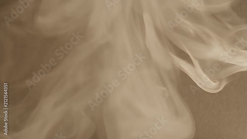 A white object emitting smoke against a textured brown background.