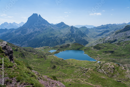Refuge d’Ayous at lake Gentau and the famous mountasin Petit Pic du Midi d'Ossau. Hautes-Pyrénées.