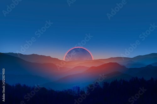 Beautiful landscape with cascade blue mountains at the morning with solar eclipse - View of wilderness mountains during foggy weather