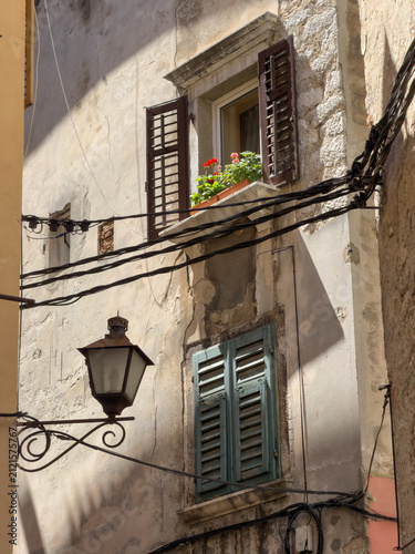 Old Town Window With Shutters And Flower Box