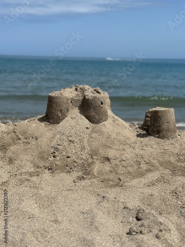 Sand castle building on a beach with sea view
