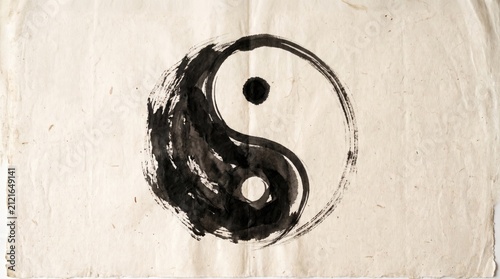 Black and white yin yang symbol hand painted on textured paper with spirituality, painting