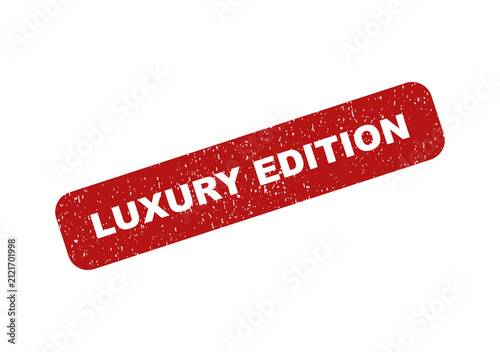 Red textured rubber stamp icon with the text luxury edition