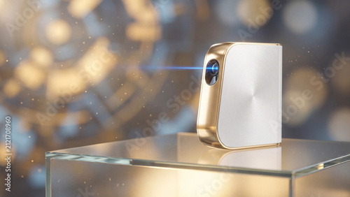 Projector device sits on a glass pedestal while emitting a bright blue laser beam in a modern studio.