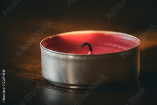 Картината върху платно Red Candle Wax Surface with Black Wick, Macro Close Up of Aromatic Candle, Minim