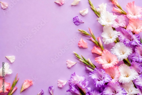 pink flowers on wooden background, gladioli