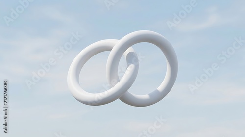 Two interlocking white rings against a pale sky. Symbol of unity and connection.