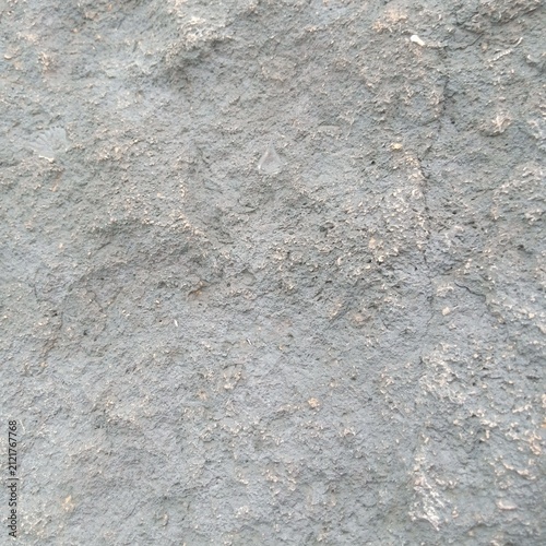Detailed Close Up Of A Rough Dark Grey Textured Stone Surface Showing Tiny Natural Grains And Crevices For Background Use