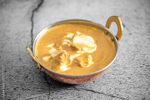 Traditional Indian vag and chicken curry served with naan flat bread. Indian curry, chicken tikka masala with rice and naan bread. Dark background. Copy space.