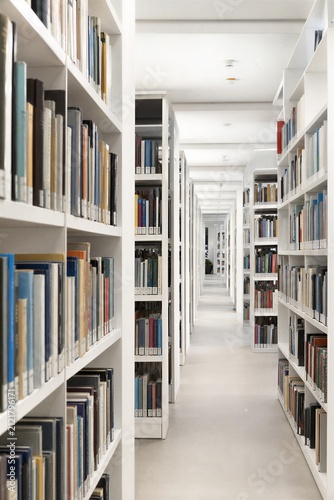 Modern library interior in Stuttgart, Germany, featuring shelves filled with books, emphasizing education and research.