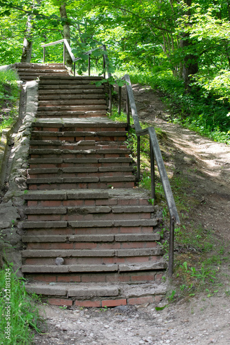 An abandoned brick staircase in an old park