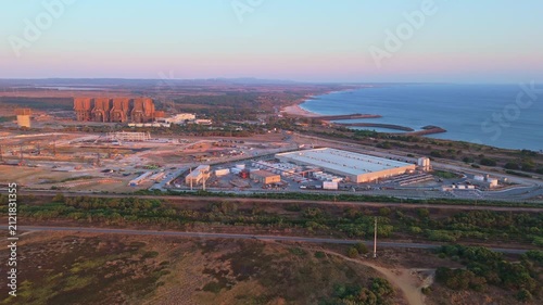 Data center building and expansion site under construction near the coastline in Sines, Portugal. Green landscape and Atlantic ocean. Aerial view. Moving forward