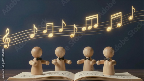 Wooden musicians sing with glowing notes above an open music book.