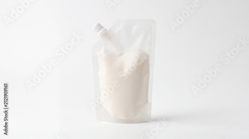 Blank spout pouch packaging template with white liquid content isolated on white background
