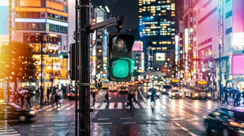 Green Traffic Light at Busy City Street at Night with Urban Bokeh