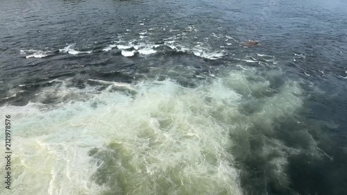 Water gushing out through the shutter of a gravity dam