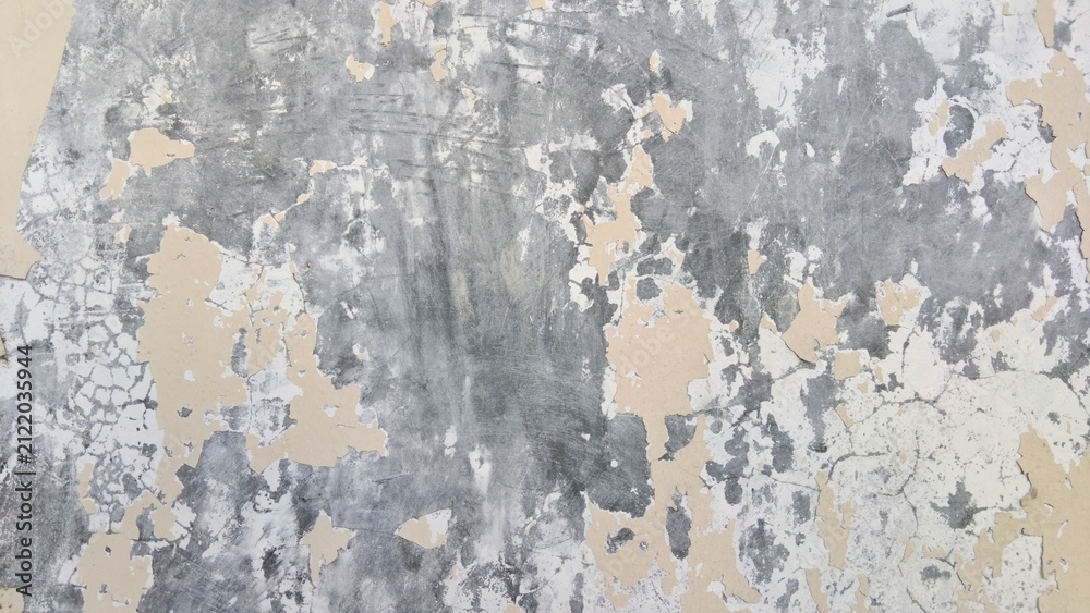 Fototapeta premium Grunge weathered concrete wall texture with peeling cream paint and cracked surface