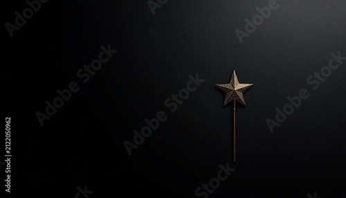 Elegant gold star shape decoration on dark background with copy space for Christmas holiday.