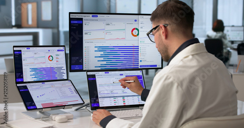 Принти на полотні Young Clinical Trial Manager Reviewing Patient Enrollment Data