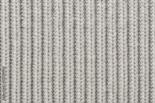 Close-up ribbed knit fabric texture with soft natural lighting background for cozy textile concepts