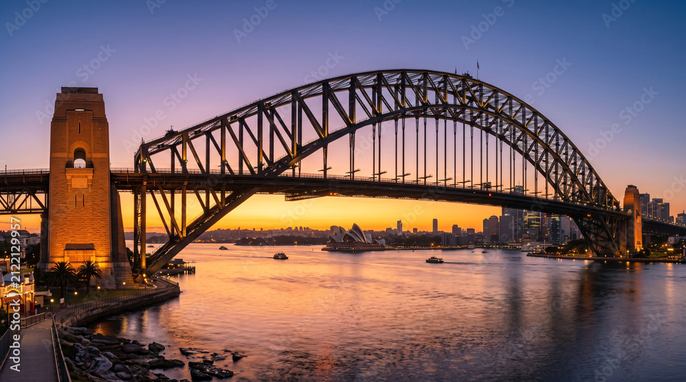 Naklejka premium Pont de Sydney au coucher du soleil sur la baie