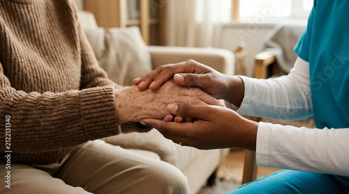 Compassionate caregiver holding senior woman's hands, elderly home care support, medical professional comforting patient in nursing home