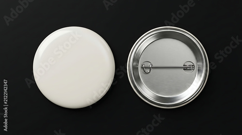 Two blank white and silver buttons on black background