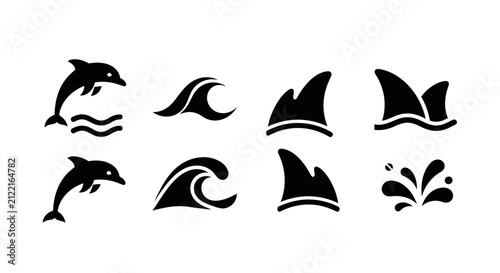 Marine life silhouettes with dolphins, waves, and shark fins.