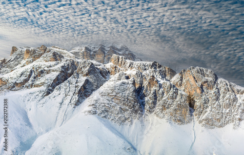 The mountain peaks turn white, offering a breathtaking view of the Tofane in Cortina d'Ampezzo.
