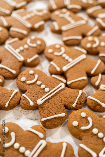 Decorating Gingerbread Man Cookies with Royal Icing for Festive Occasions