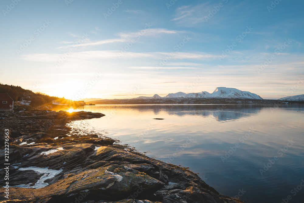 Fototapeta premium Wide view from a rocky shore beside Balsfjord in Troms, Northern Norway