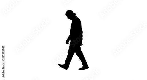 Bild auf Leinwand Silhouette of a Man Walking in Thoughtful Manner.